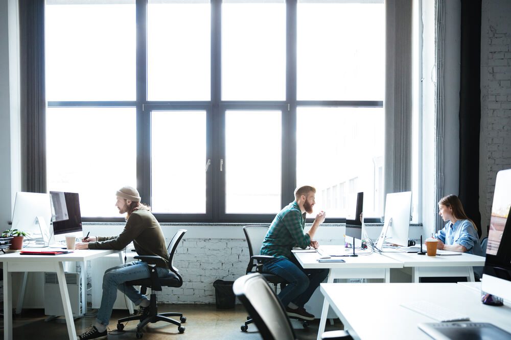 young-colleagues-work-office-using-computers