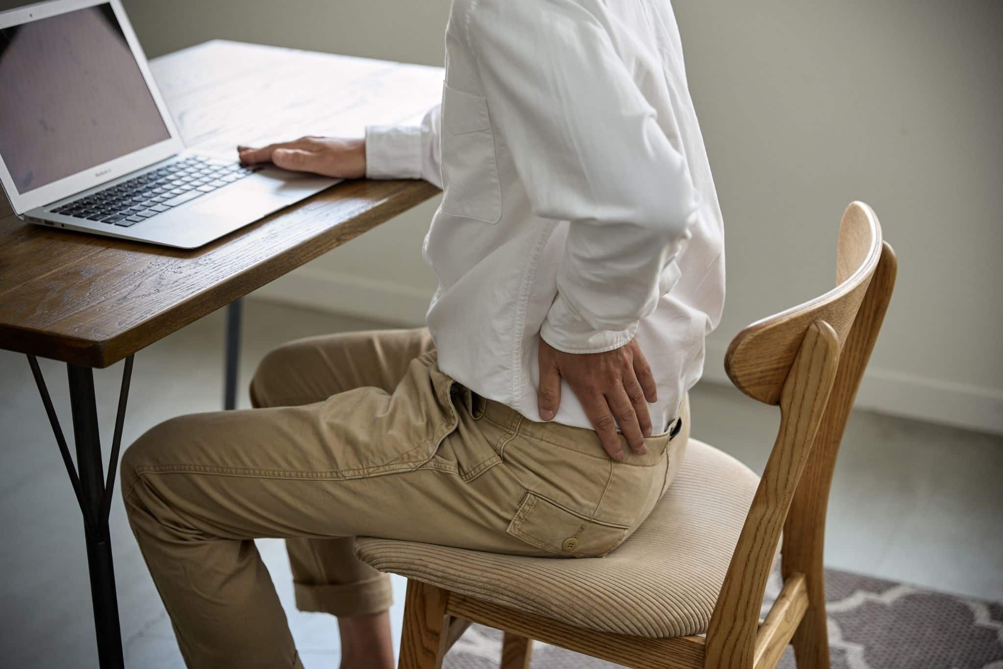 Men experiencing lower back pain