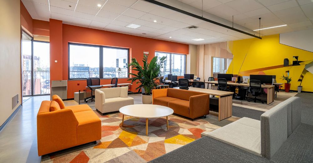 Vibrant, open-plan office lounge area; feng shui office.