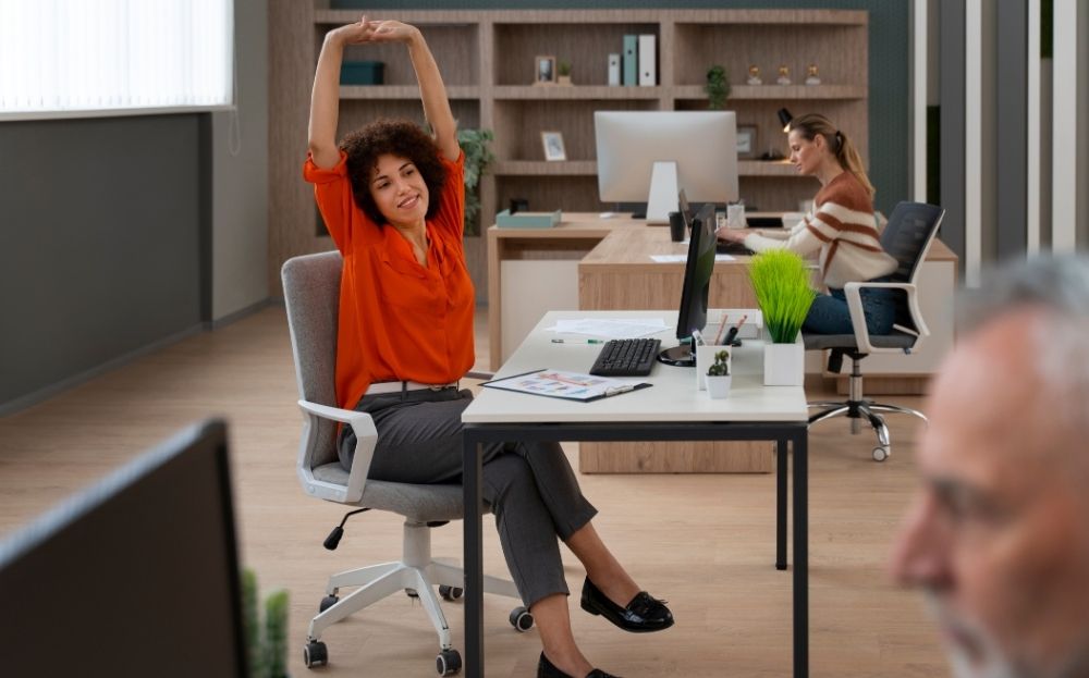 Girl stretching on her office seat