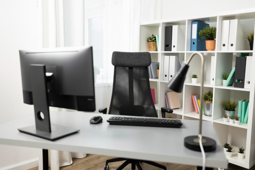 Modern office setup with file shelf in the background