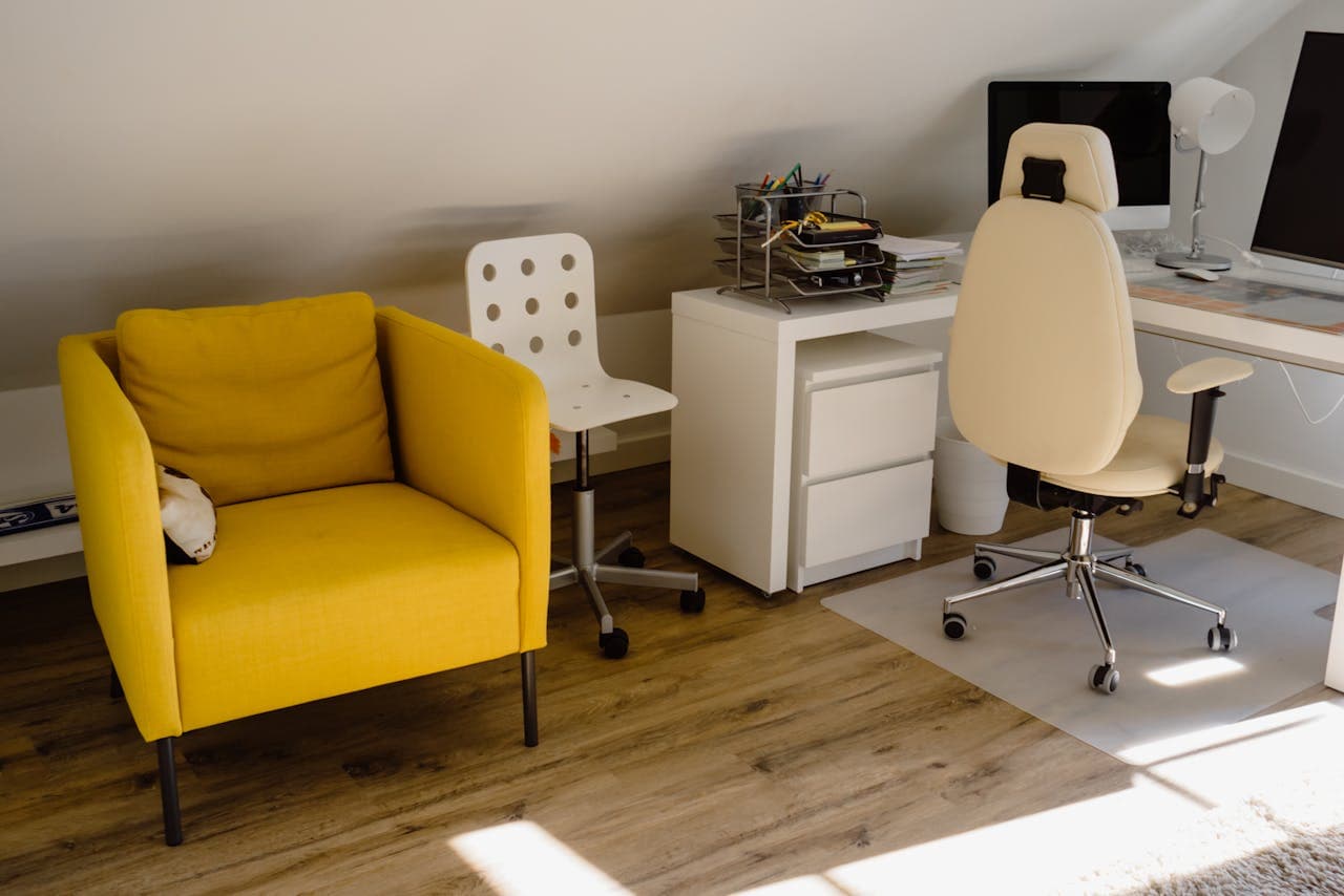 modern home office with a bright yellow armchair