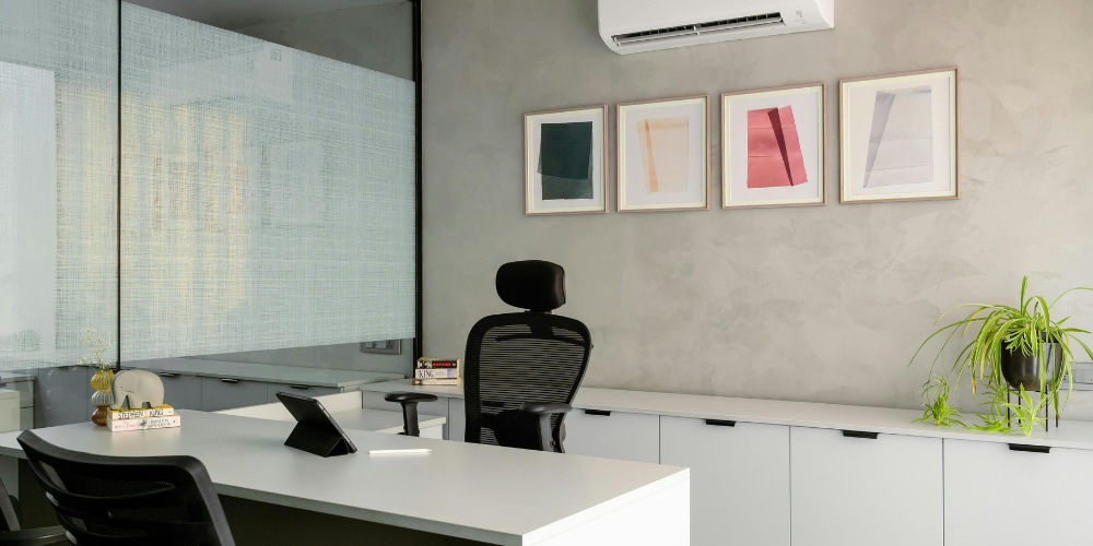 minimalist office interior featuring a sleek white desk