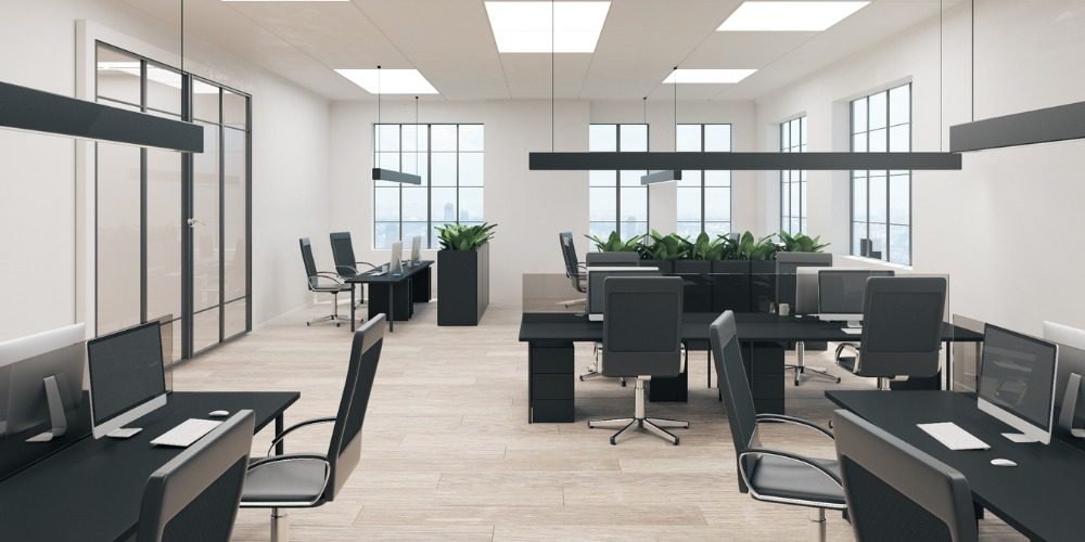 corporate office featuring rows of black desks