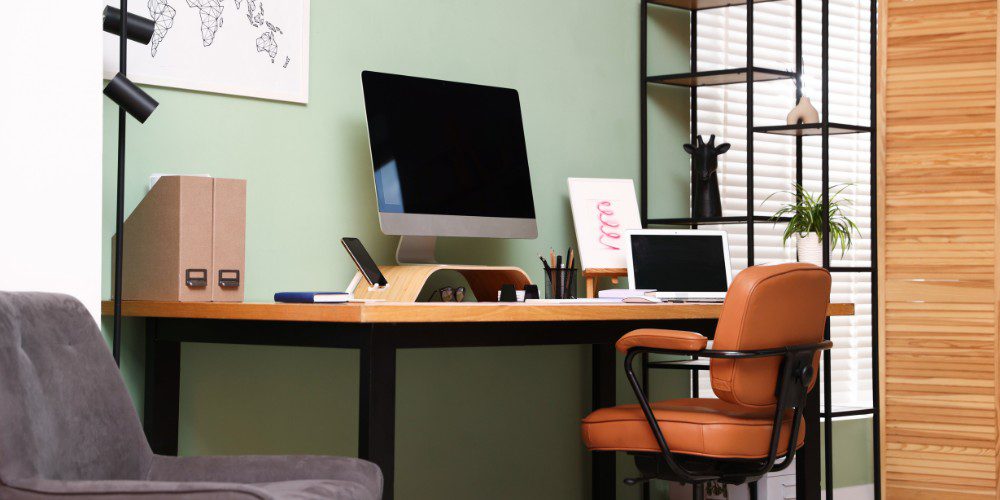 A modern home office setup featuring a wooden desk