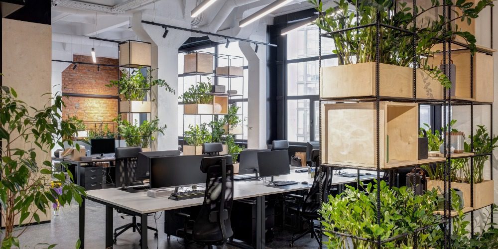 open-plan office space featuring industrial-style desks