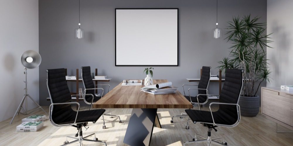a conference room with a central wooden table